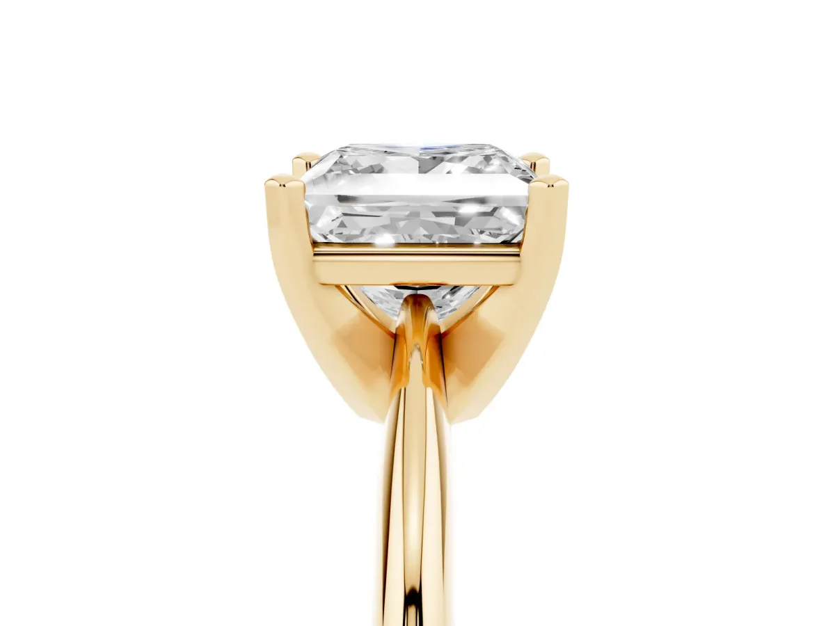 Princess Cut Cut Solitaire Ring with Four-Prong Setting on a Classic Band Yellow gold