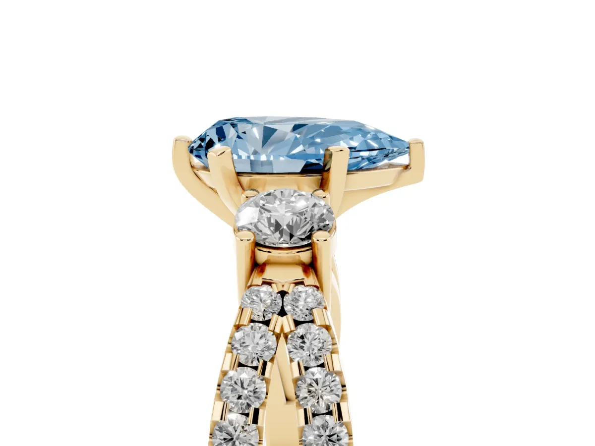 Fancy Blue Pear Cut Diamond Three-Stone Ring with Pavé Split Shank and Four-Prong Setting Yellow gold