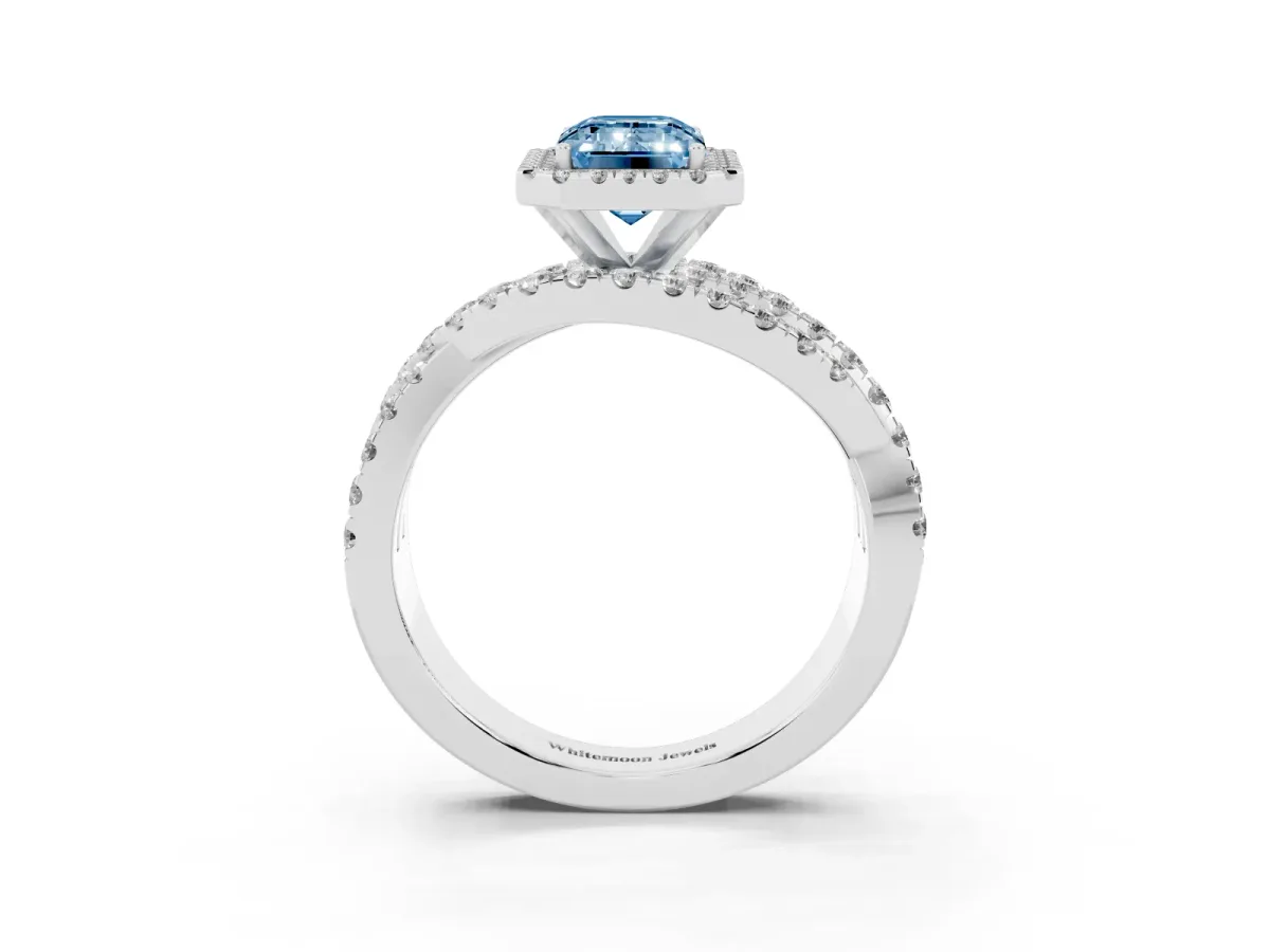 Fancy Blue Emerald Cut Diamond Halo Ring with Round Split Shank and Prong Setting Platinum