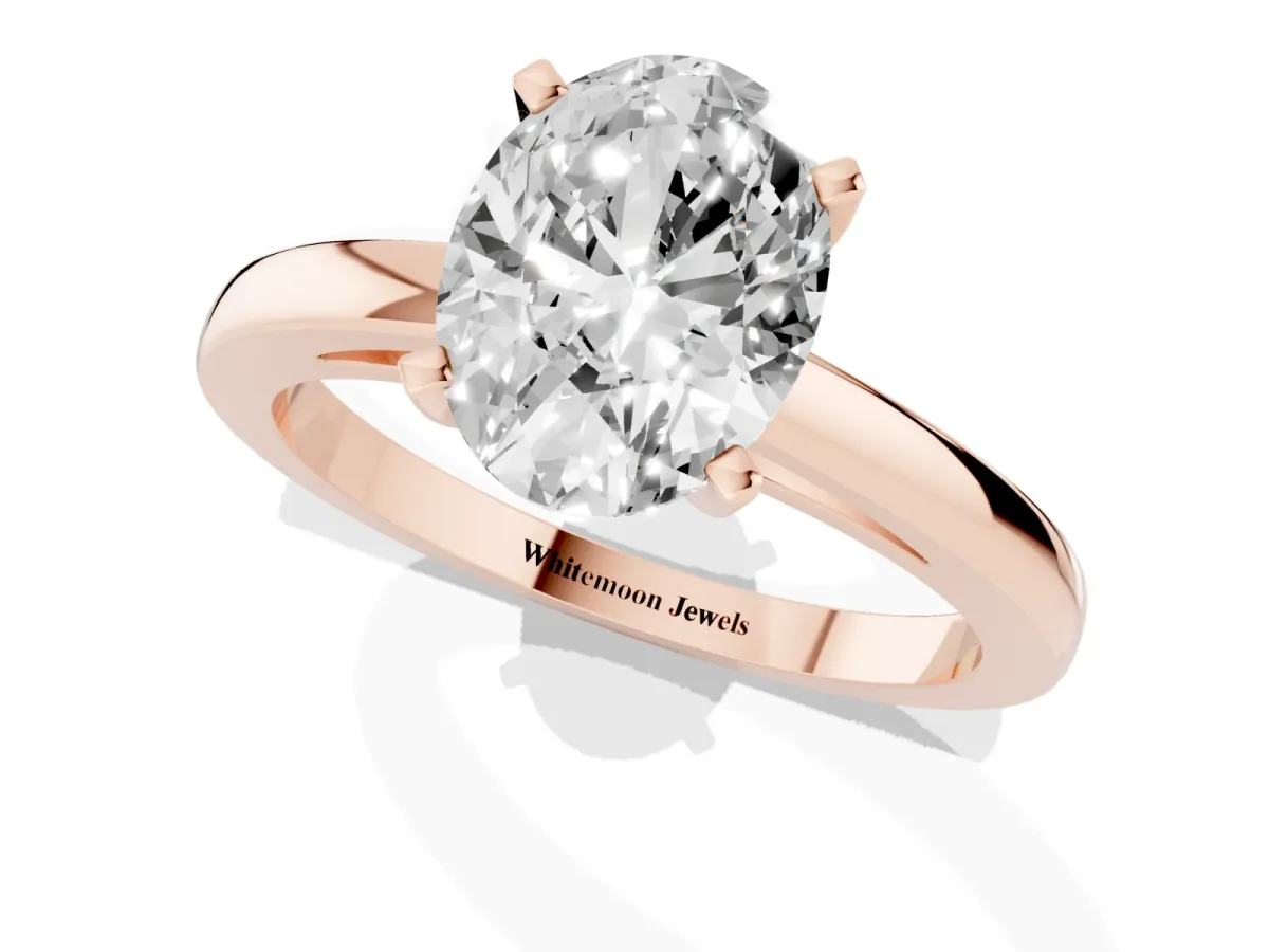 Oval Cut Solitaire Diamond Engagement Ring with Four-Prong Setting on a Classic Band Rose gold