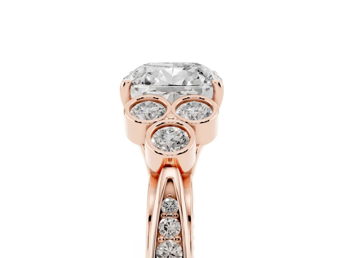 Cushion Cut Cut Diamond Engagement Ring with Bezel Set Round Side Stones and Prong Setting Rose gold