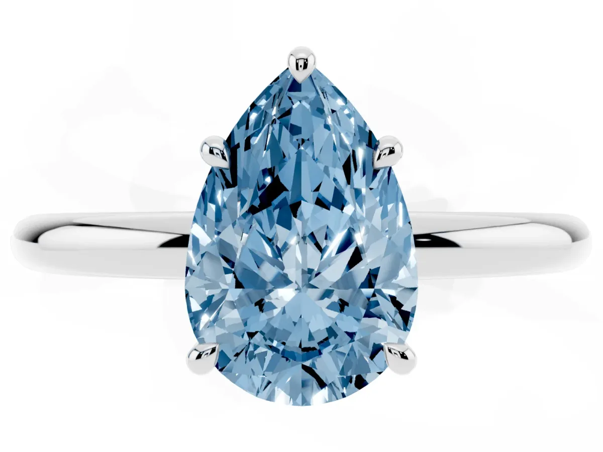 Fancy Blue Pear Cut Diamond Solitaire Ring with Thin Band and Four-Prong Setting Silver