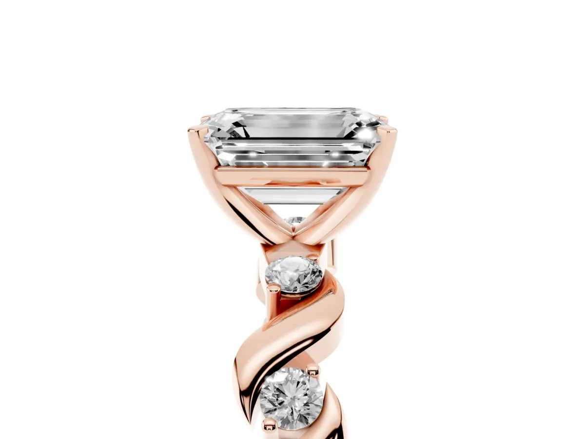 Emerald Cut Diamond Solitaire Twisted Band with Round Accents and Prong Setting Rose gold