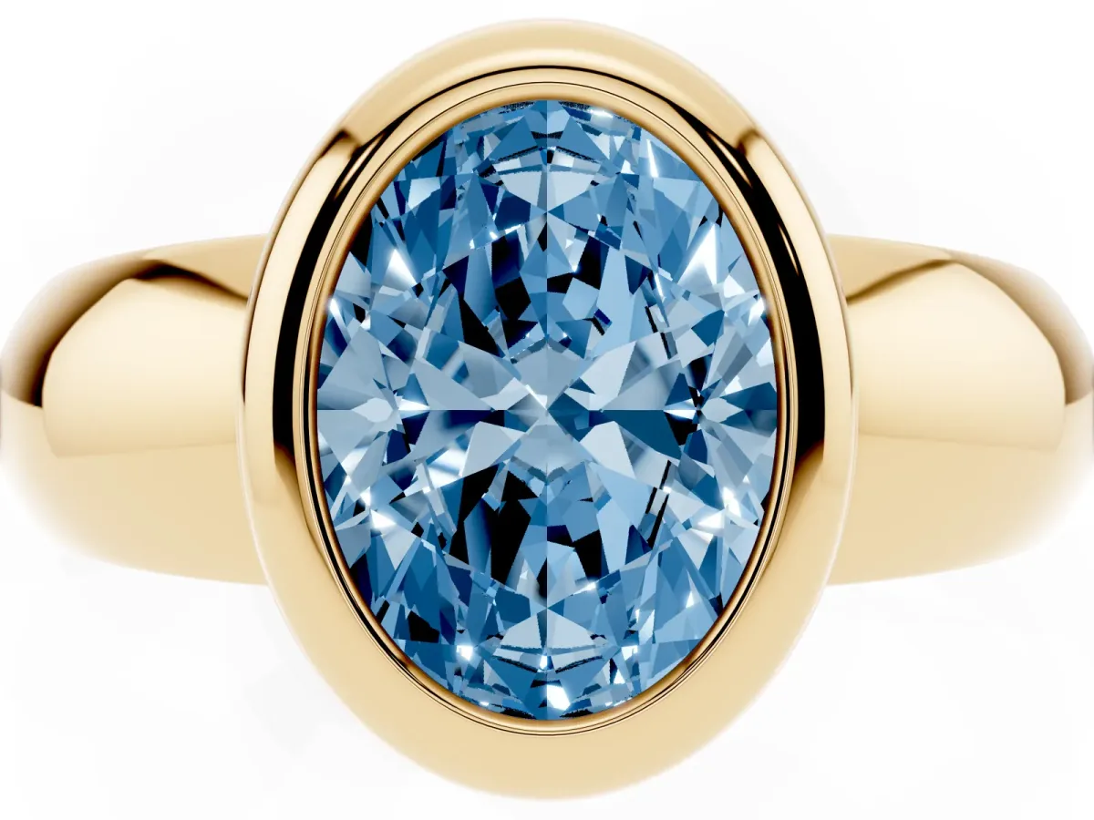 Fancy Blue Bezel Set Oval Cut Solitaire Ring with Wide Band Yellow gold