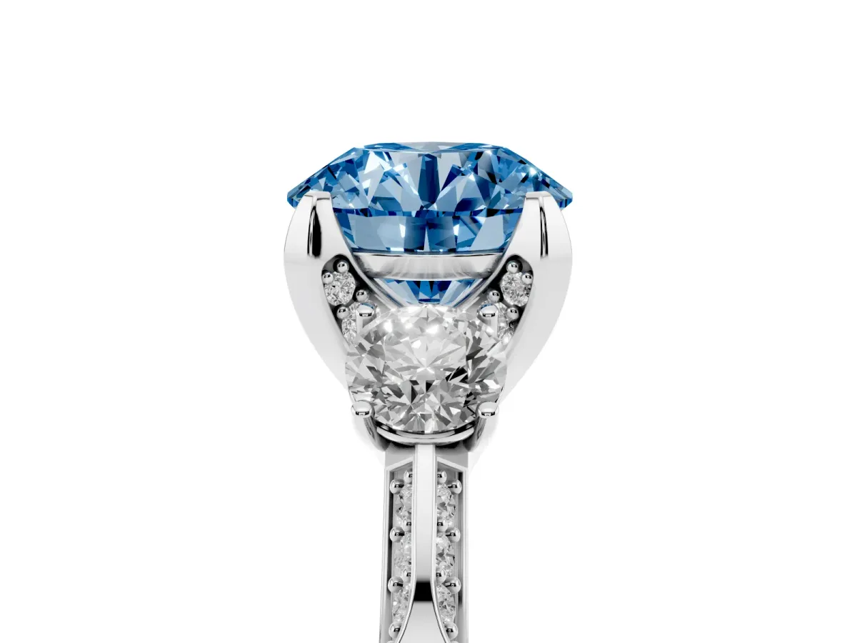 Fancy Blue Round Cut Brilliant Three-Stone Diamond Ring with Pavé Band and Four-Prong Setting Silver
