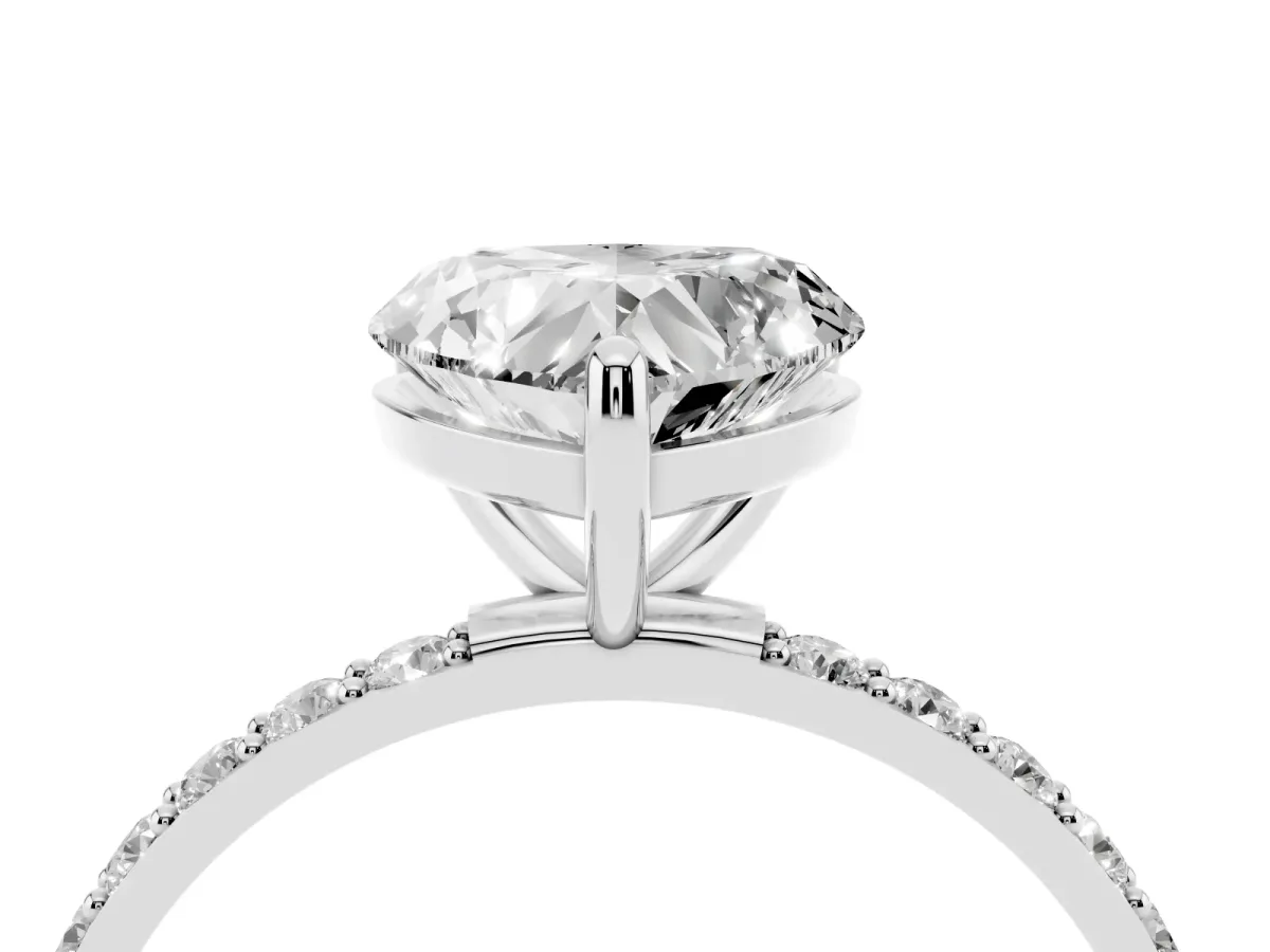 Heart Cut Diamond Solitaire Ring with Round Pavé Band and Prong Setting Silver
