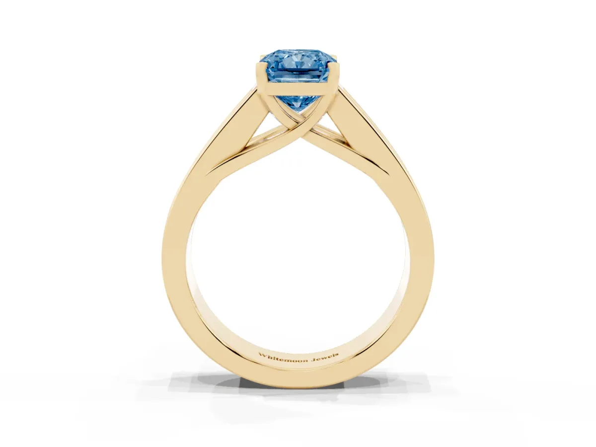 Fancy Blue Radiant Cut Cut Channel Set Solitaire Ring with Four-Prong Setting Yellow gold