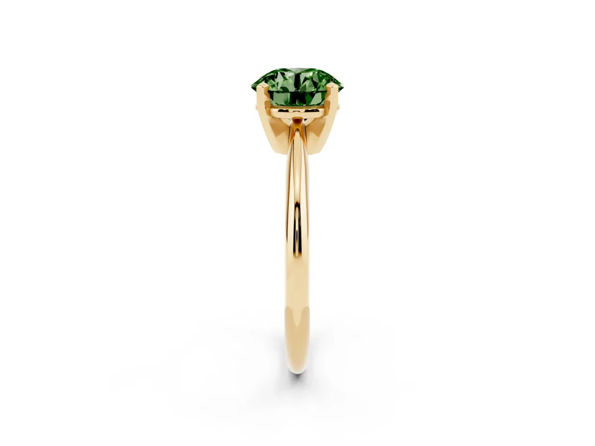 Fancy Green Round Cut Cut Solitaire Ring with Four-Prong Setting on a Classic Band Yellow gold