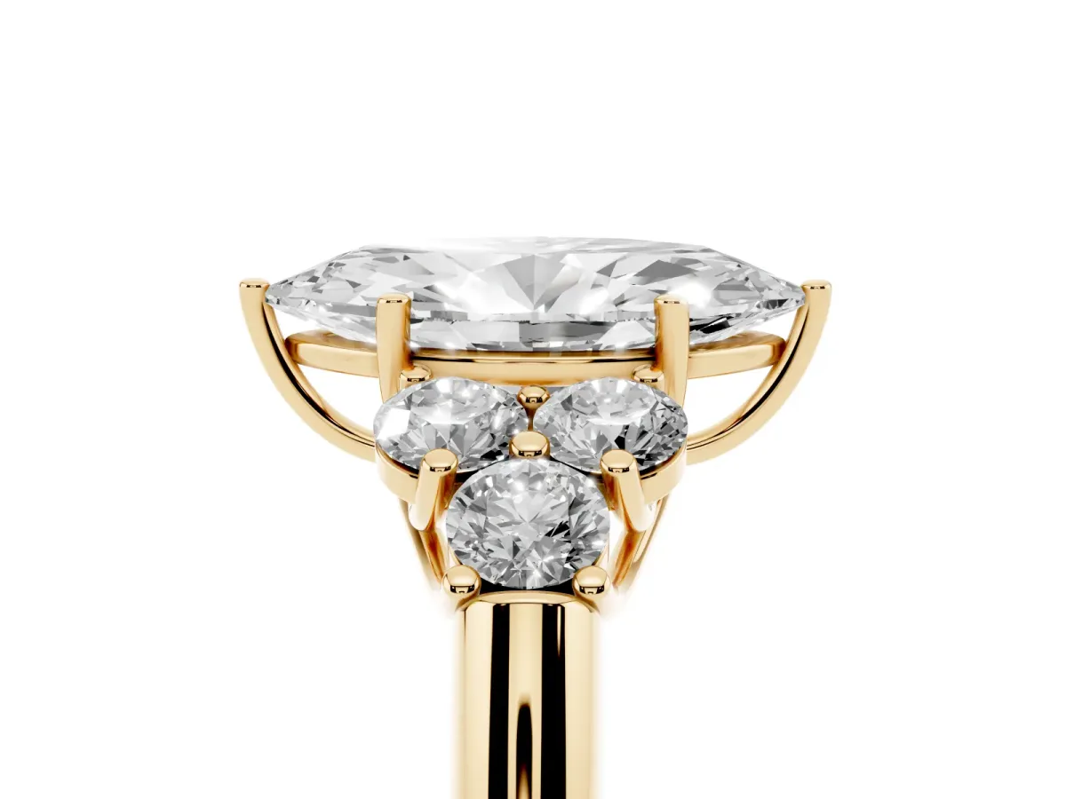Marquise Cut Cut Diamond Cluster Ring with Round Accent Stones and Prong Setting on a Classic Band Yellow gold
