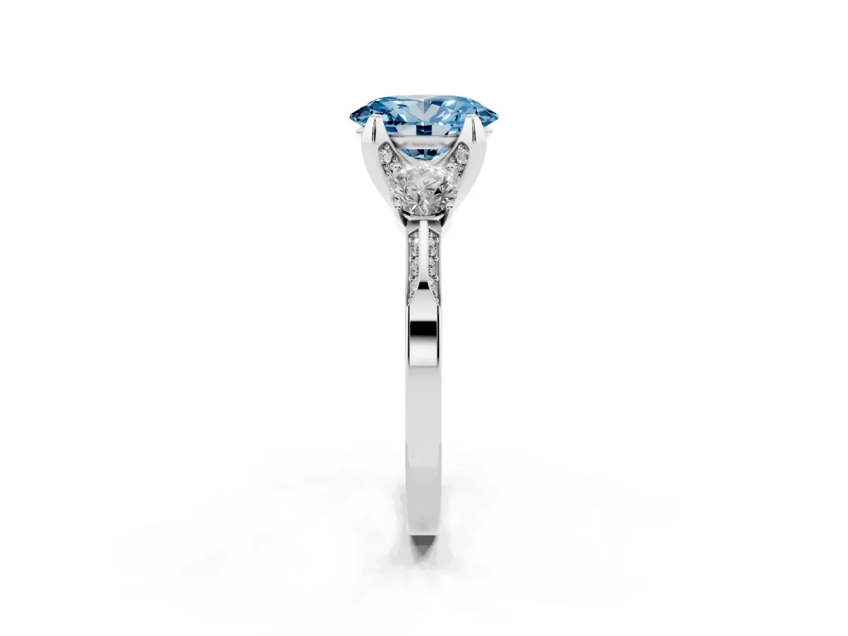 Fancy Blue Oval Cut Brilliant Three-Stone Diamond Ring with Pavé Band and Four-Prong Setting White gold