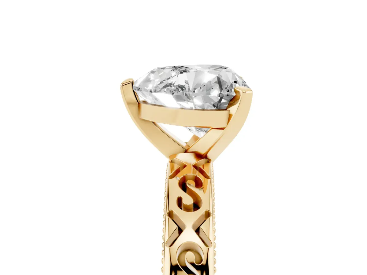 Heart Cut Solitaire Engagement Ring with Scrollwork Band and Four-Prong Setting Yellow gold