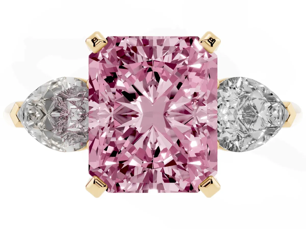 Fancy Pink Three-Stone Radiant Cut Diamond Ring with Pear Side Stones and Four-Prong Setting Yellow gold