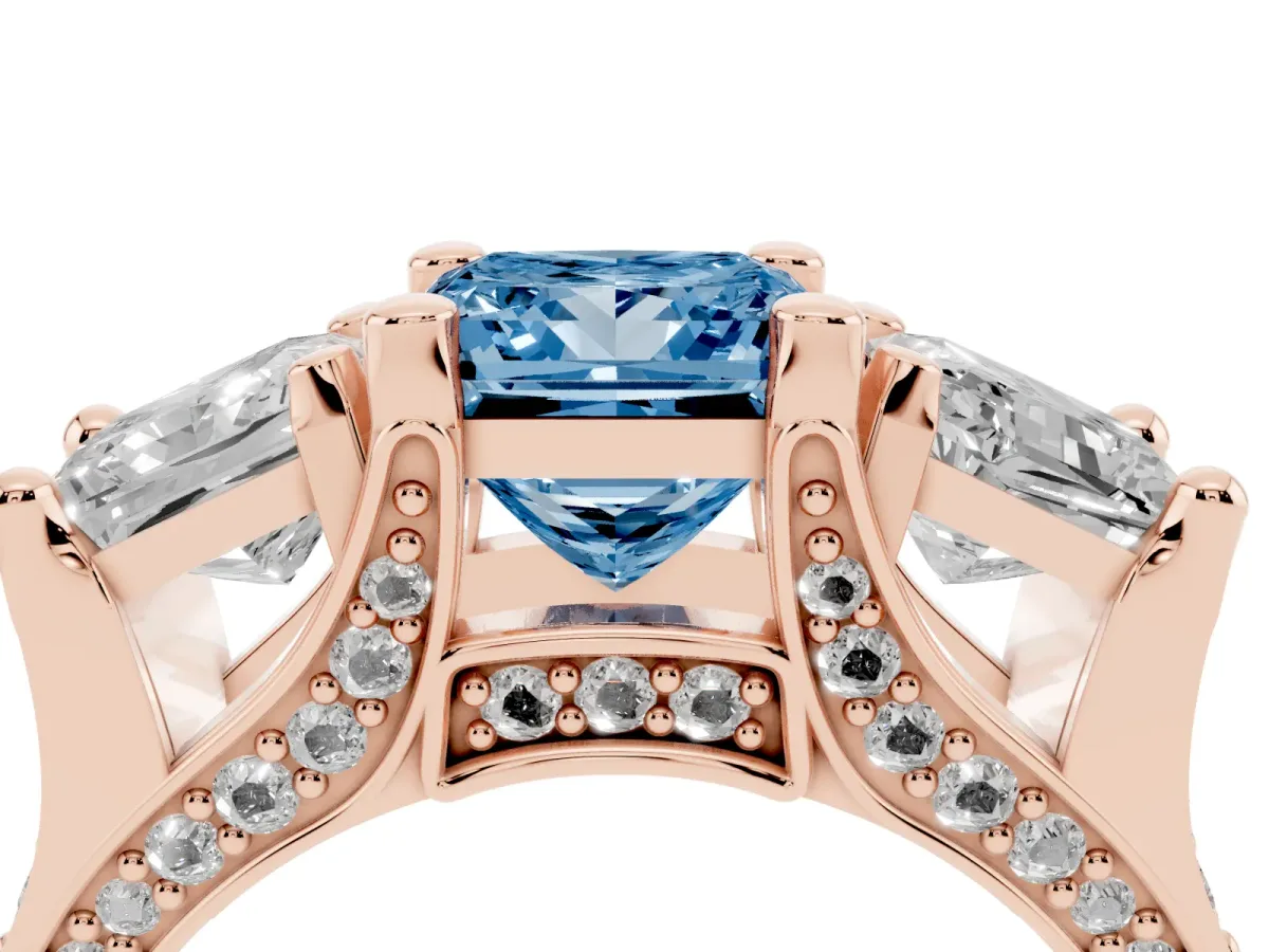 Fancy Blue Princess Cut Diamond Three-Stone Ring with Channel Set Band and Four-Prong Setting Rose gold