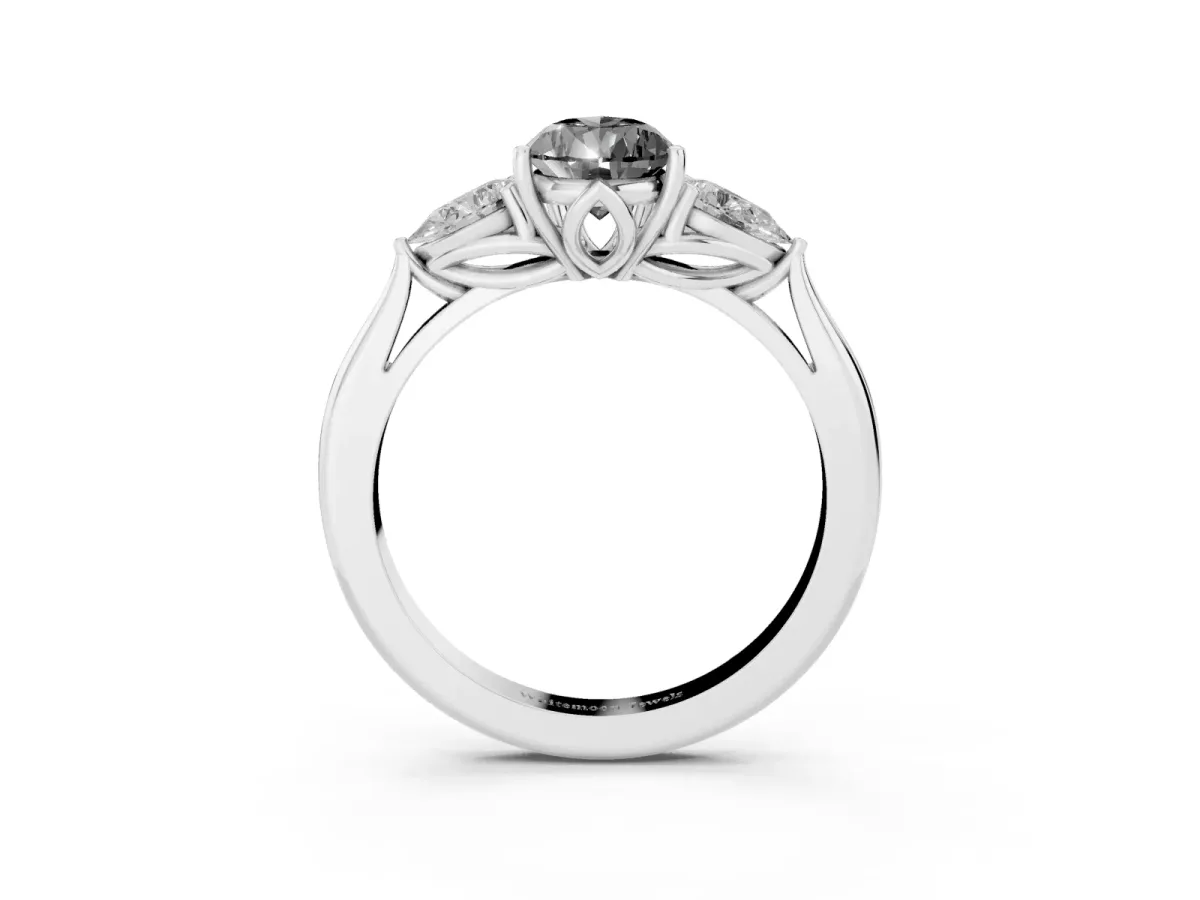Fancy Black Three-Stone Pear Cut Brilliant Diamond Solitaire Ring with Tapered Band and Four-Prong Setting Platinum