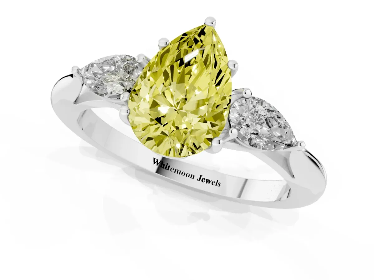 Fancy Yellow Three-Stone Pear Cut Diamond Ring with Pear Side Stones in Four-Prong Setting Platinum