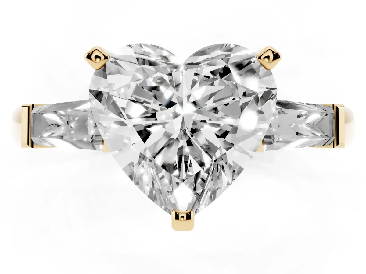 Heart Cut Solitaire with Tapered Baguette Side Stones on a Classic Band with Four-Prong Setting Yellow gold