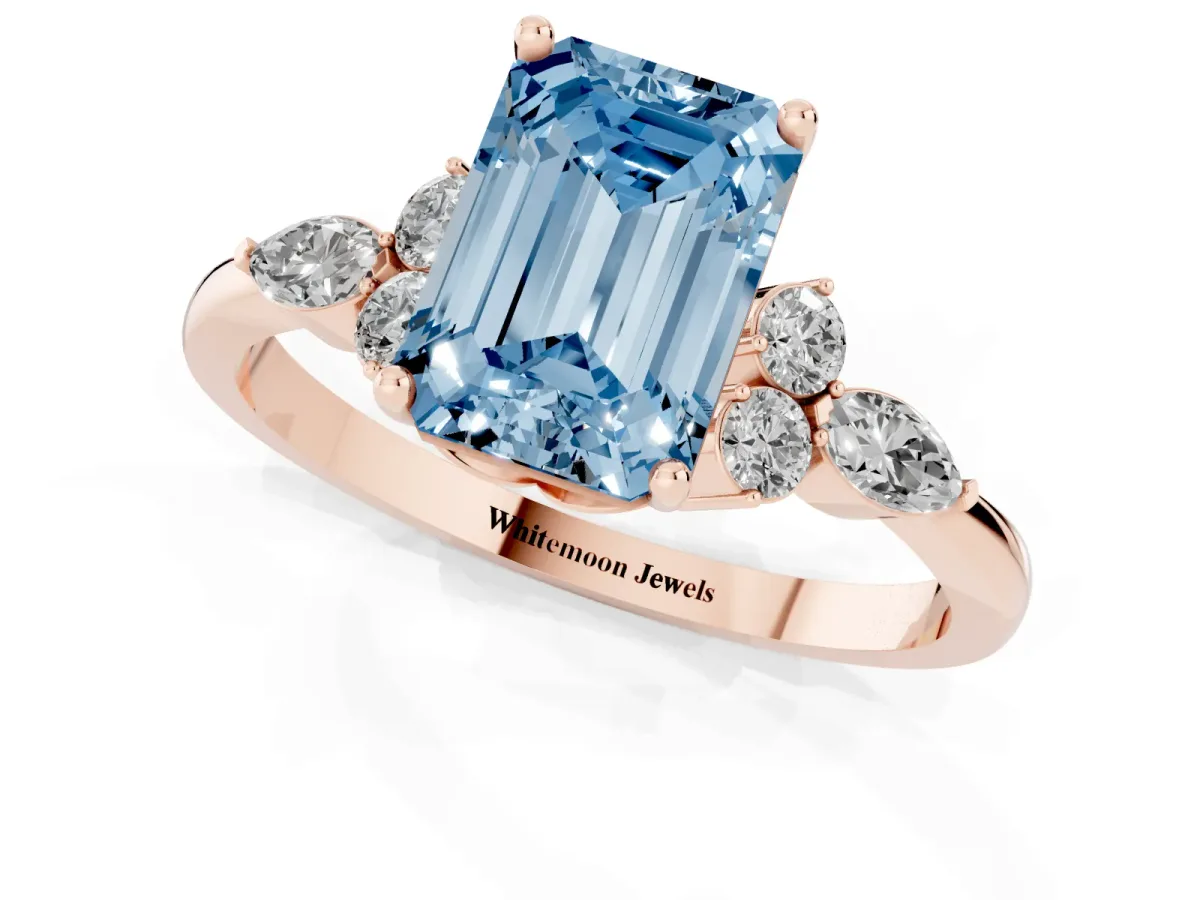 Fancy Blue Emerald Cut Brilliant Diamond Solitaire Ring with Pear Side Stones and Four-Prong Setting Rose gold