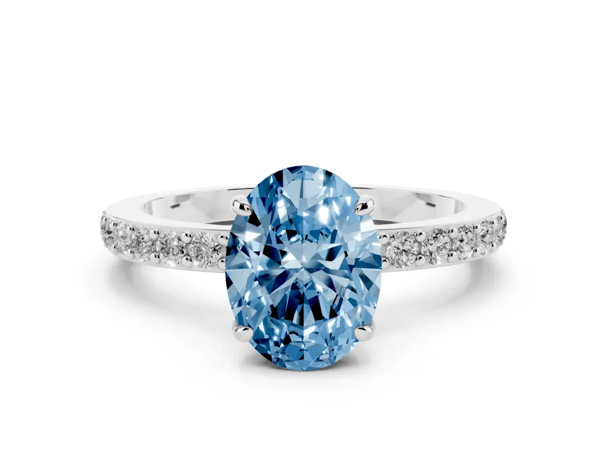 Fancy Blue Oval Cut Diamond Pavé Engagement Ring with Round Accents and Prong Setting Platinum