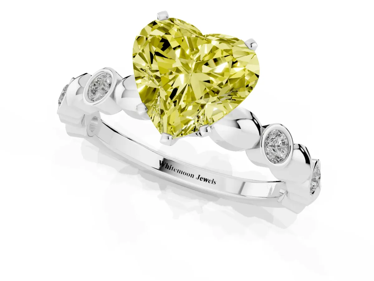 Fancy Yellow Heart Cut Solitaire Bezel-Set Diamond Ring with Beaded Band and Four-Prong Setting Silver