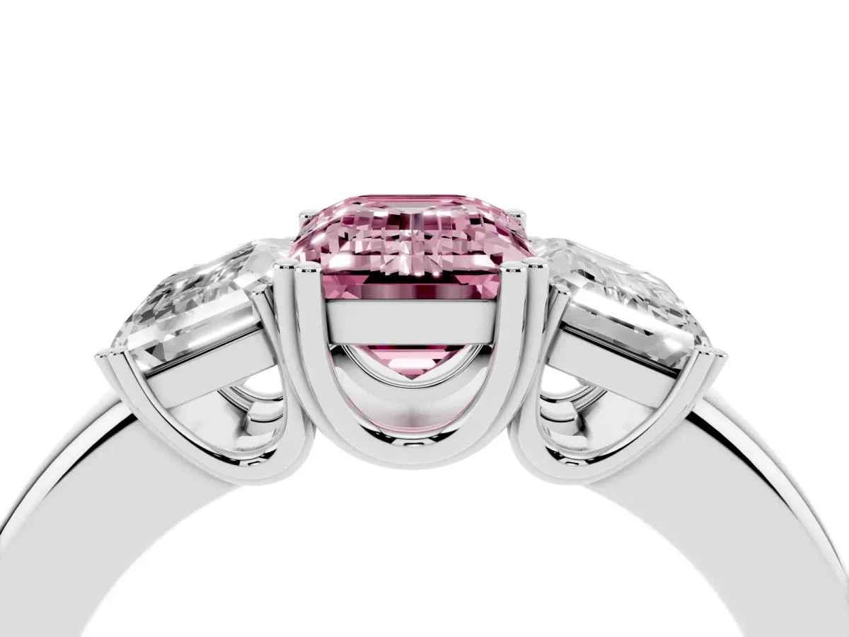 Fancy Pink Three-Stone Emerald Cut Cut Diamond Ring with Channel Set Band and Four-Prong Setting Silver