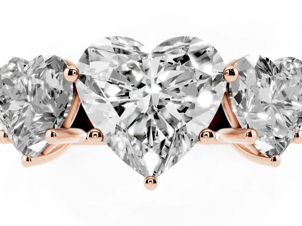 Heart Cut Three-Stone Diamond Ring with Prong Setting on a Classic Band Rose gold
