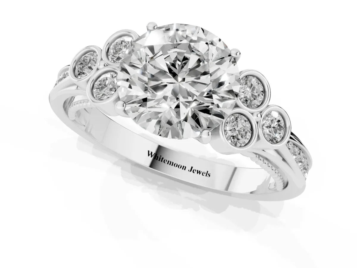 Round Cut Cut Diamond Engagement Ring with Bezel Set Round Side Stones and Prong Setting White gold