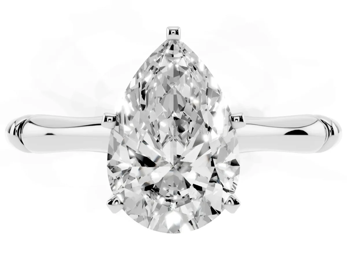 Pear Cut Solitaire Diamond Ring with Bamboo Band and Four-Prong Setting Platinum