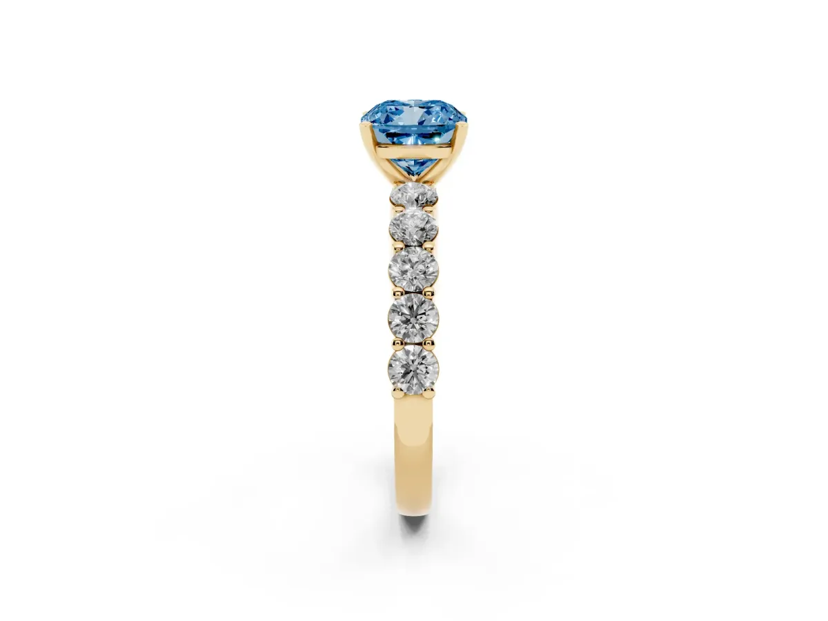 Fancy Blue Cushion Cut Diamond Solitaire Ring with Shared Prong Round Side Stones Yellow gold