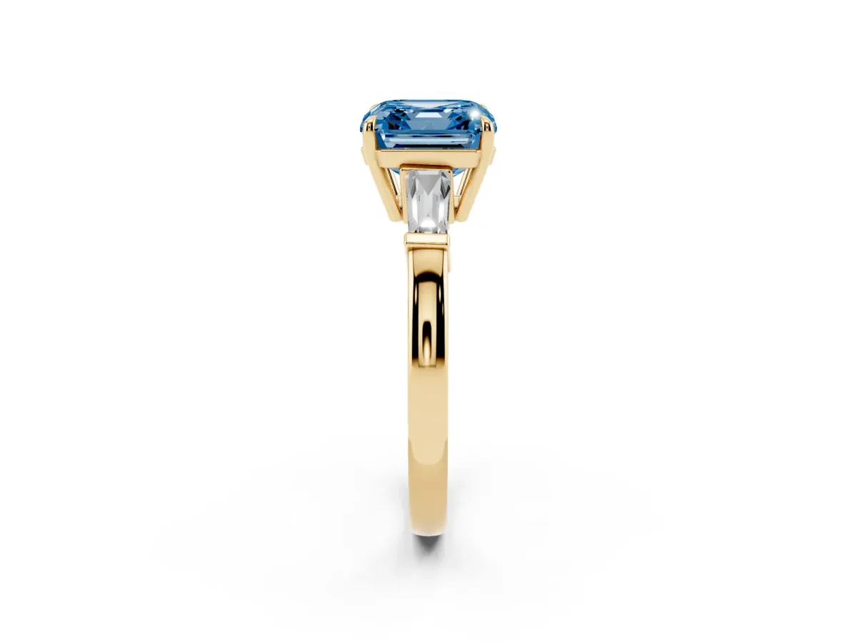 Fancy Blue Asscher Cut Diamond Three-Stone Ring with Tapered Baguette Side Stones and Prong Setting Yellow gold