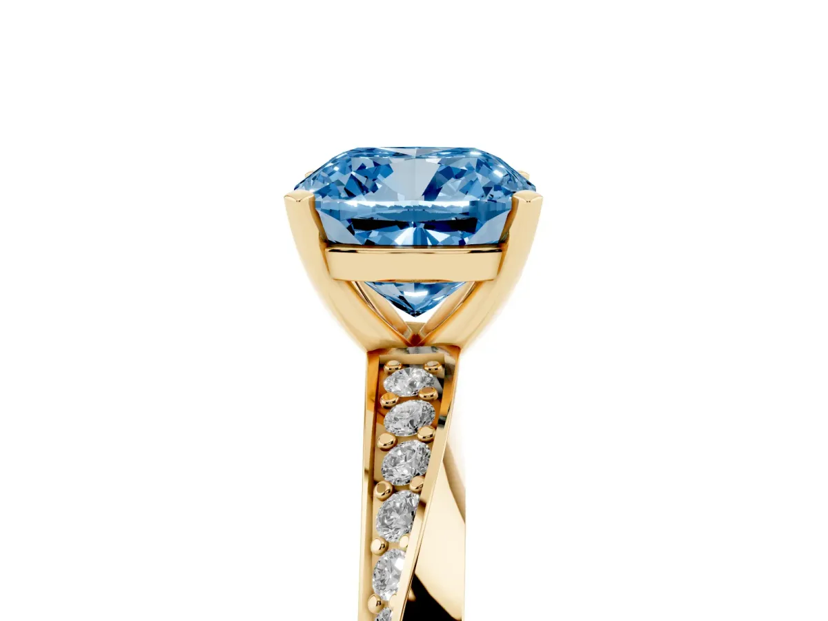 Fancy Blue Cushion Cut Diamond Engagement Ring with Side Stone Accents and Four-Prong Setting Yellow gold