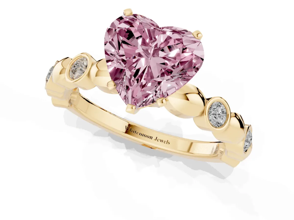 Fancy Pink Heart Cut Solitaire Bezel-Set Diamond Ring with Beaded Band and Four-Prong Setting Yellow gold