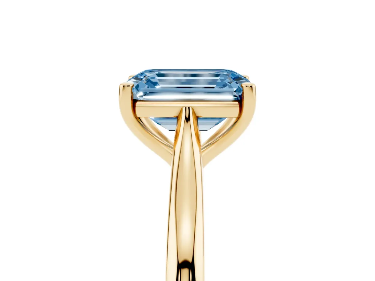 Fancy Blue Emerald Cut Cut Solitaire Ring with Cathedral Band and Four-Prong Setting Yellow gold