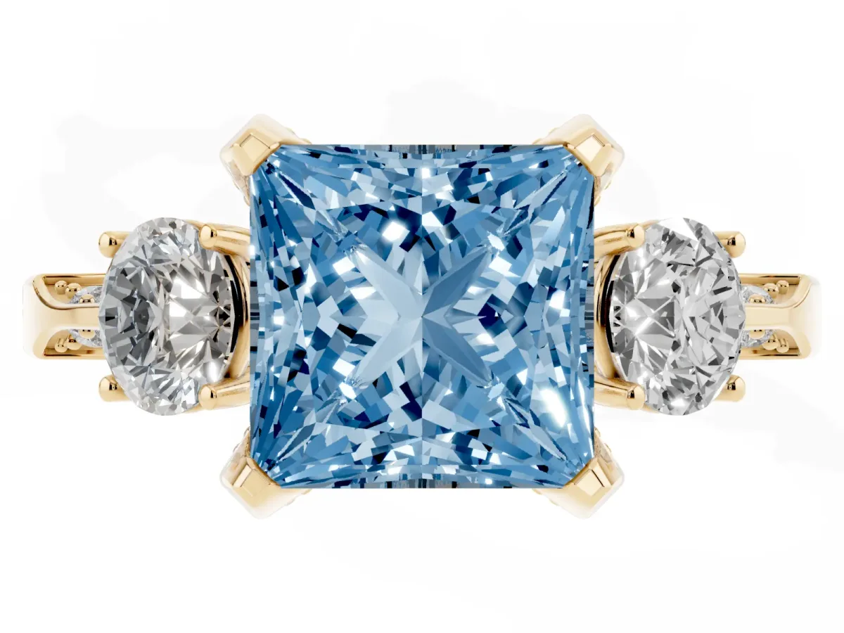 Fancy Blue Princess Cut Brilliant Three-Stone Diamond Ring with Pavé Band and Four-Prong Setting Yellow gold