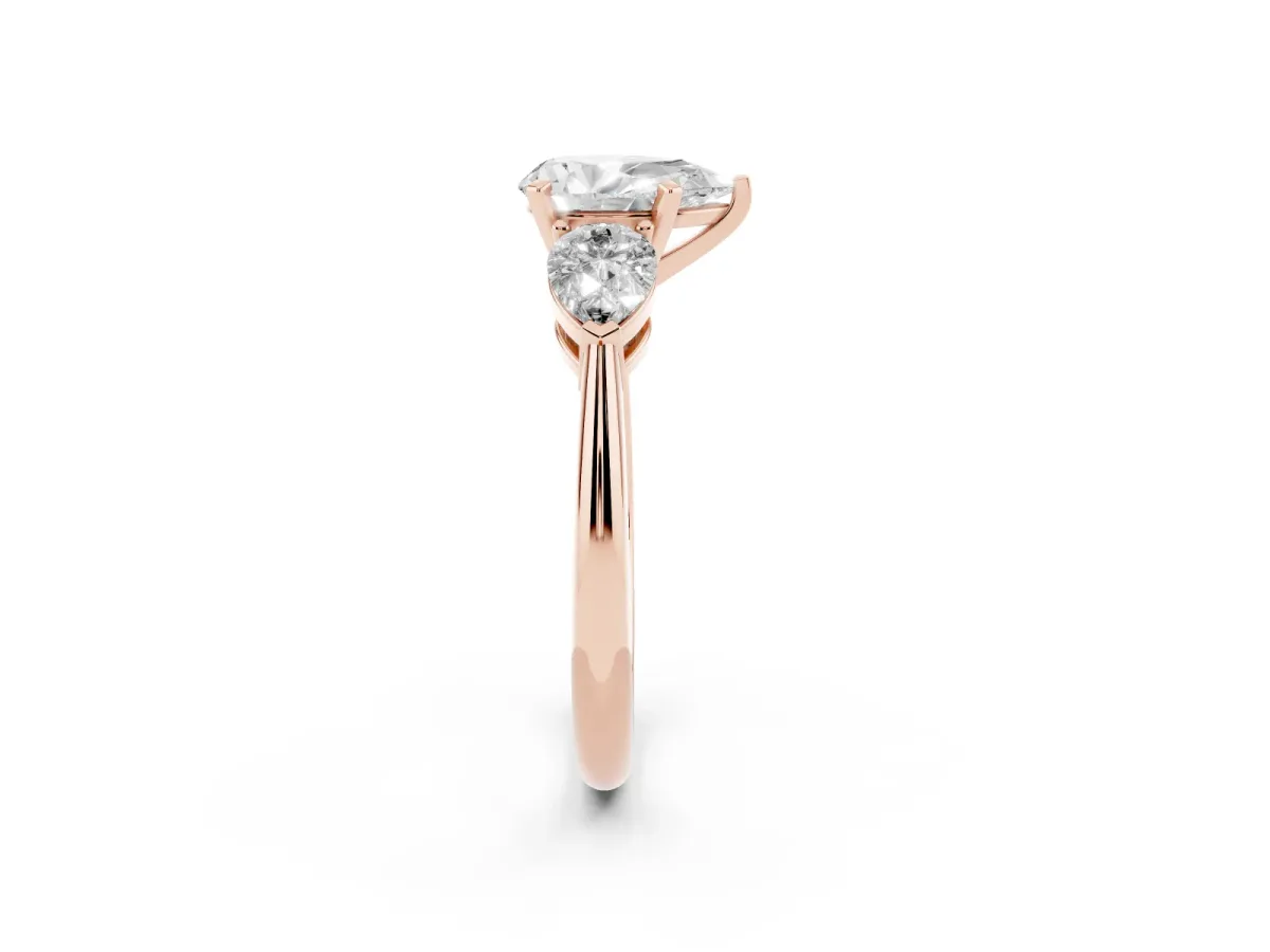 Three-Stone Pear Cut Diamond Ring with Pear Side Stones and Four-Prong Setting Rose gold