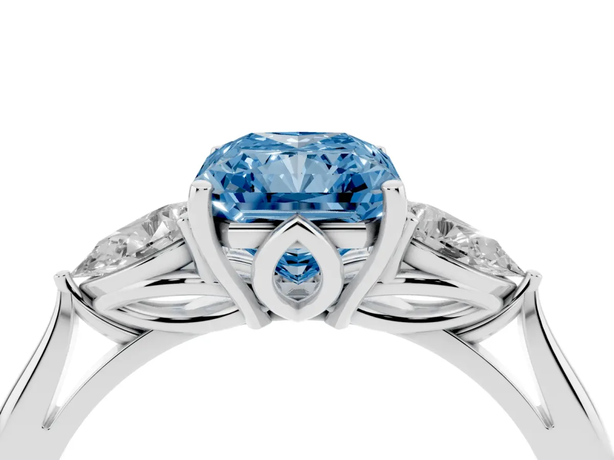 Fancy Blue Radiant Cut Diamond Three-Stone Ring with Pear Side Stones and Prong Setting Platinum