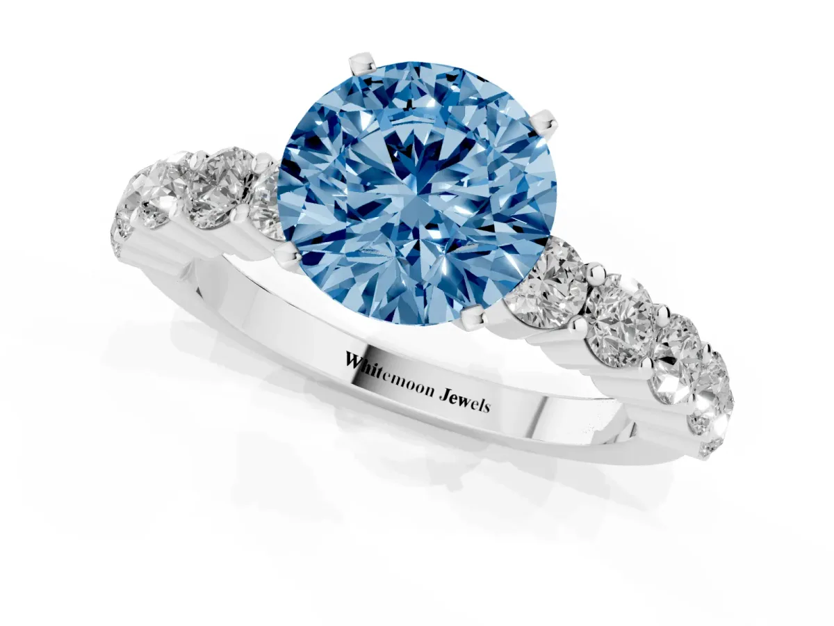Fancy Blue Round Cut Diamond Solitaire Ring with Shared Prong Round Side Stones Silver
