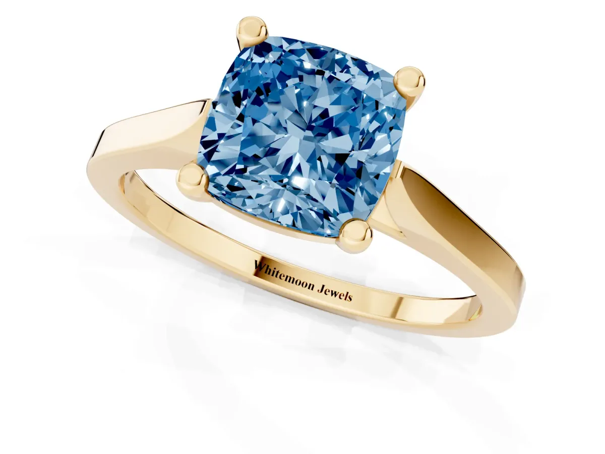 Fancy Blue Cushion Cut Solitaire Diamond Ring with Four-Prong Setting and Tapered Band Yellow gold