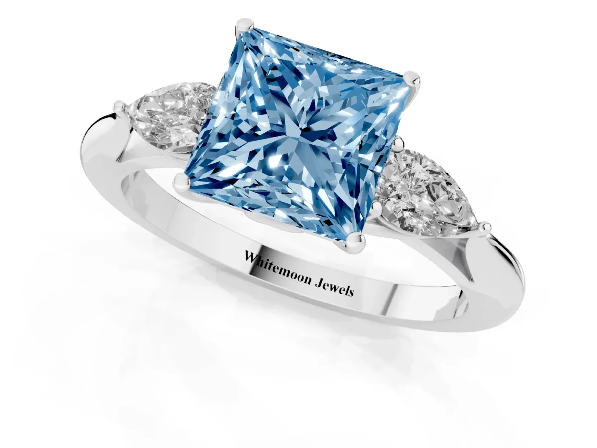 Fancy Blue Three-Stone Princess Cut Diamond Ring with Pear Side Stones in Four-Prong Setting Silver
