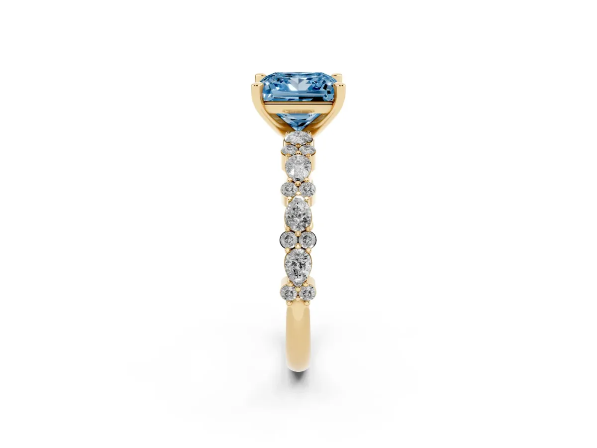 Fancy Blue Princess Cut Diamond Side Stone Solitaire Ring with Round and Four-Prong Setting Yellow gold