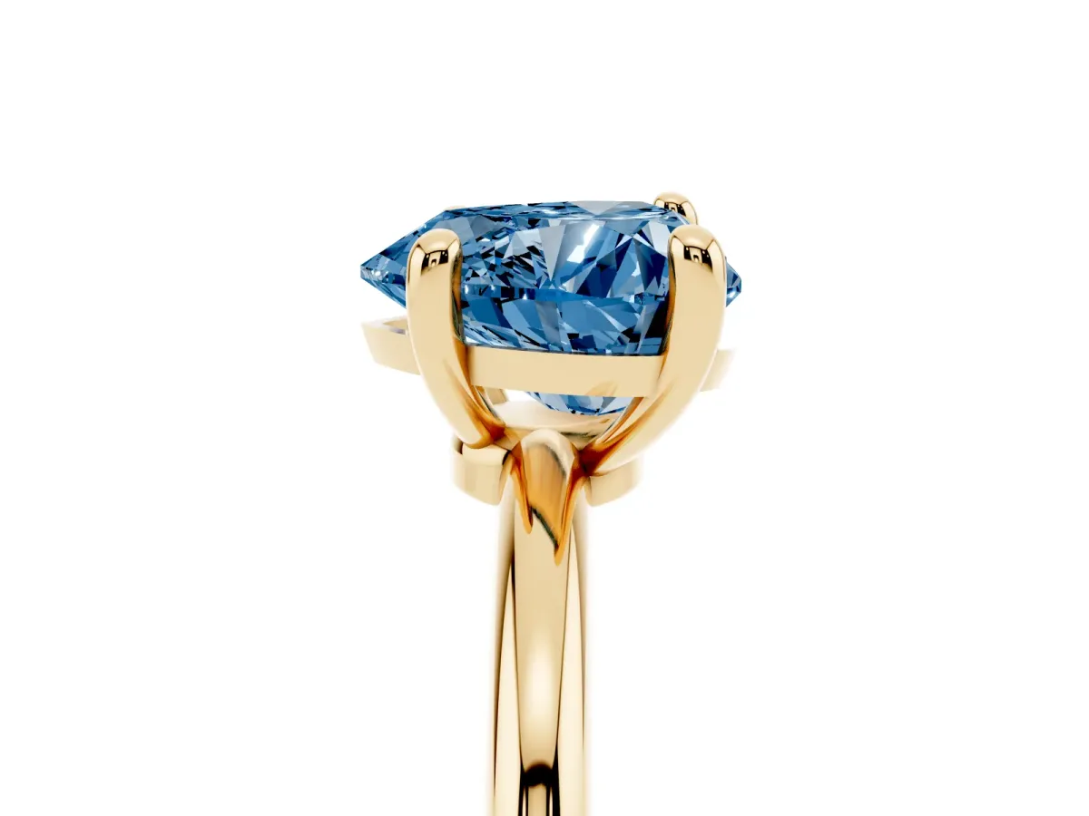 Fancy Blue Heart Cut Solitaire Diamond Ring with 4-Prong Setting on a Classic Band Yellow gold