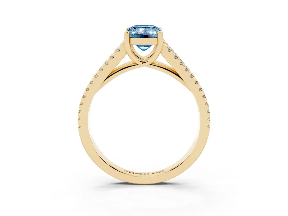 Fancy Blue Emerald Cut Diamond Solitaire Engagement Ring with Split Shank Pavé Band Yellow gold