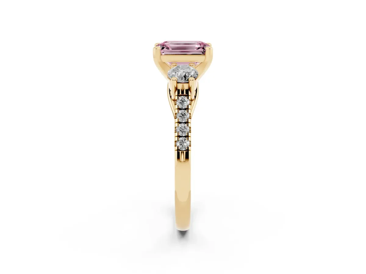 Fancy Pink Three-Stone Emerald Cut Diamond Pavé Band with Four-Prong Setting Yellow gold