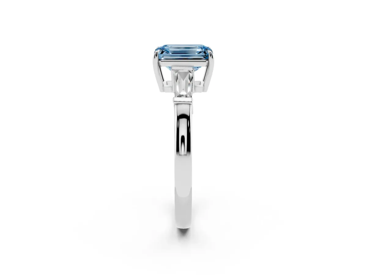 Fancy Blue Emerald Cut Diamond Three-Stone Ring with Tapered Baguette Side Stones and Prong Setting Platinum
