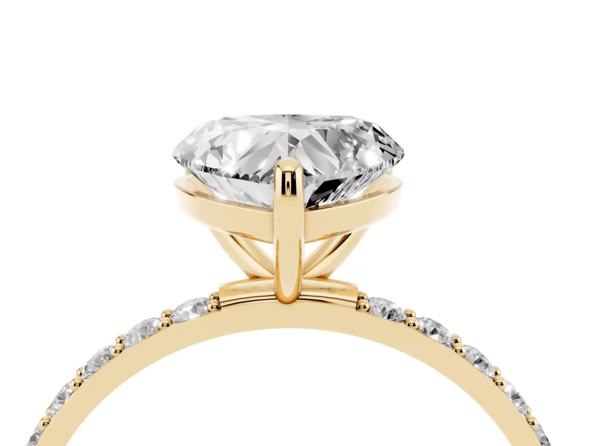 Heart Cut Diamond Solitaire Ring with Round Pavé Band and Prong Setting Yellow gold