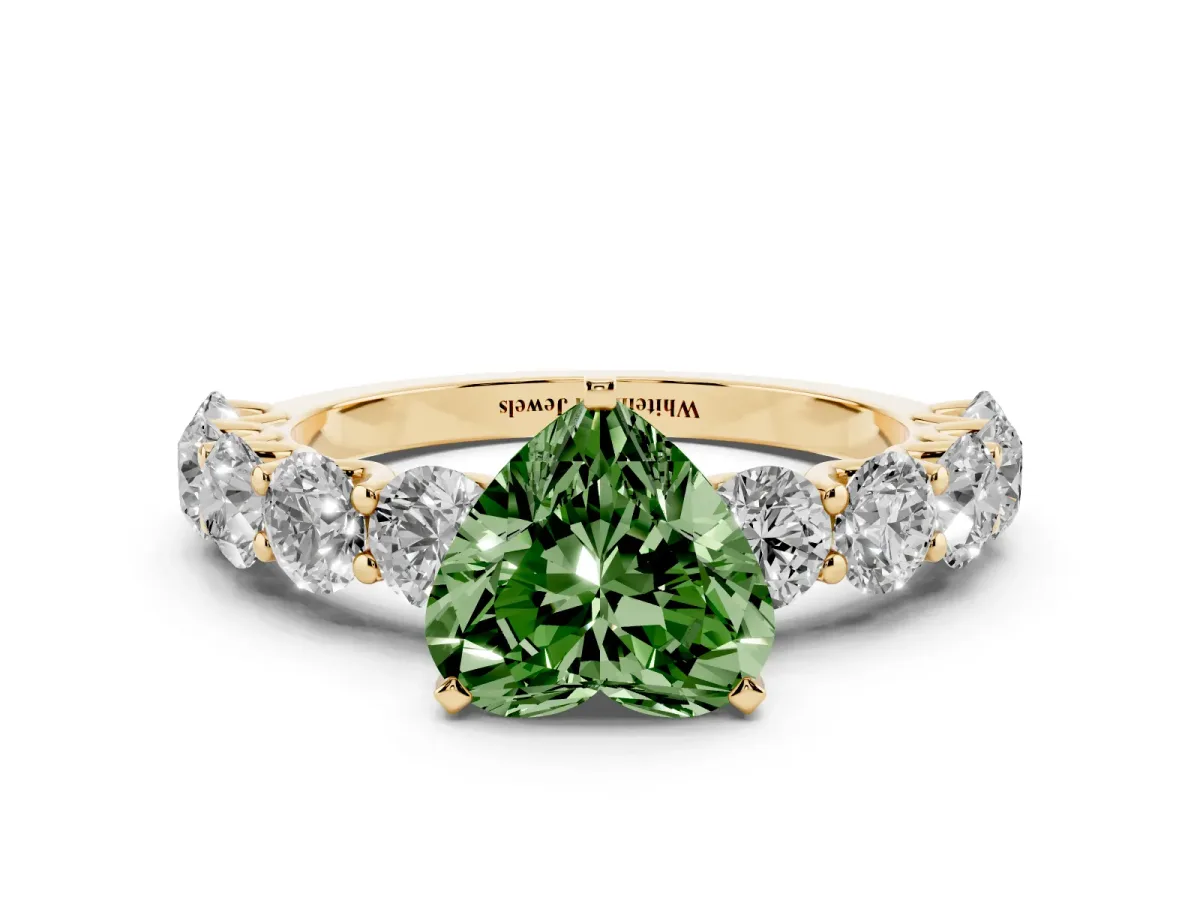 Fancy Green Heart Cut Diamond Prong Setting with Side Stones on a Pave Band Yellow gold