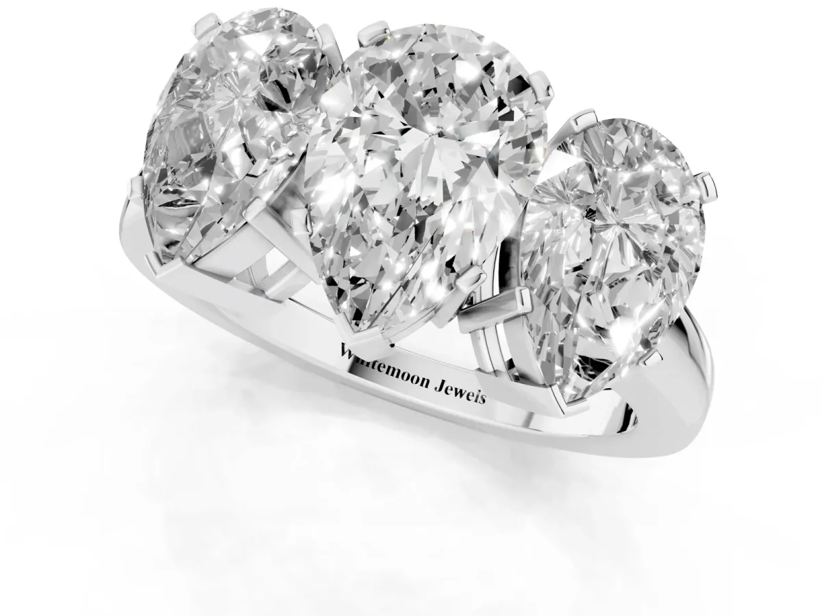 Three-Stone Pear Cut Cut Diamond Ring with Channel Set Band and Four-Prong Setting Platinum