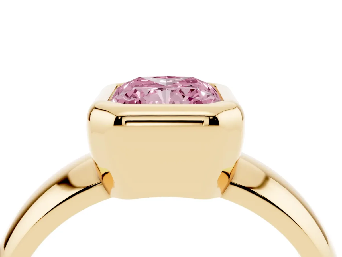 Fancy Pink Bezel Set Radiant Cut Solitaire Ring with Wide Band Yellow gold