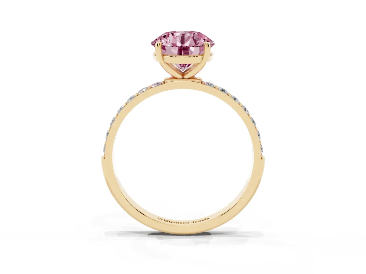 Fancy Pink Round Cut Diamond Solitaire Ring with Round Pavé Shoulders and Prong Setting Yellow gold