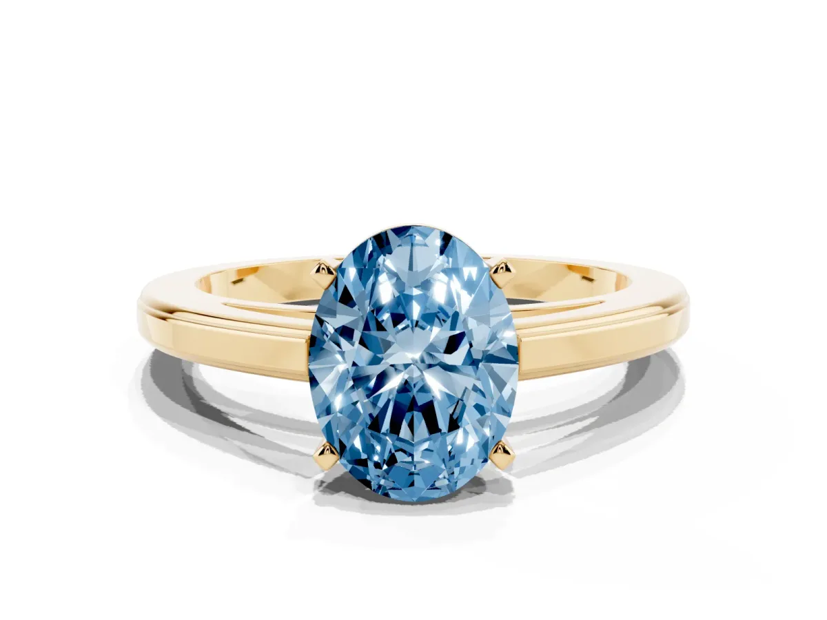 Fancy Blue Oval Cut Solitaire Diamond Ring with Four-Prong Setting and Classic Band Yellow gold