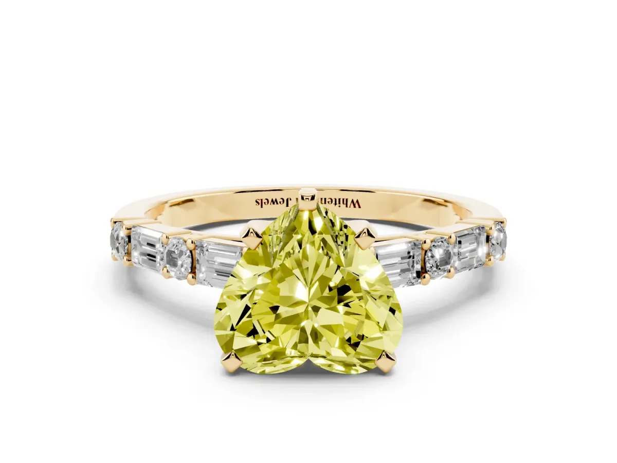 Fancy Yellow Heart Cut Diamond Solitaire with Side Baguettes and Channel Set Band Yellow gold